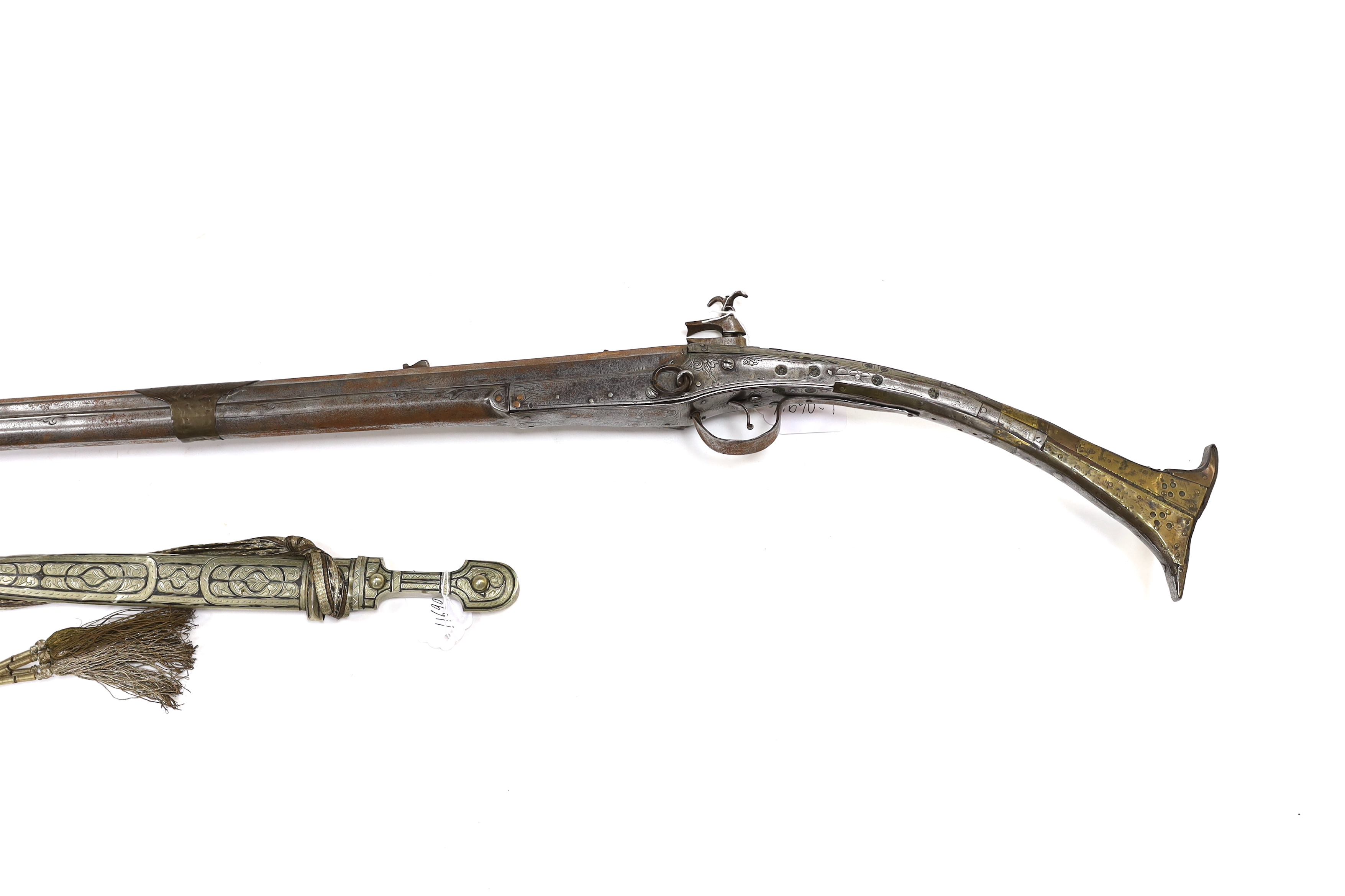 A 19th century Albanian flintlock miquelet lock rifle (Balkan long arm) and a Caucasian style dagger, with niello work scabbard, barrel 122cm (2)